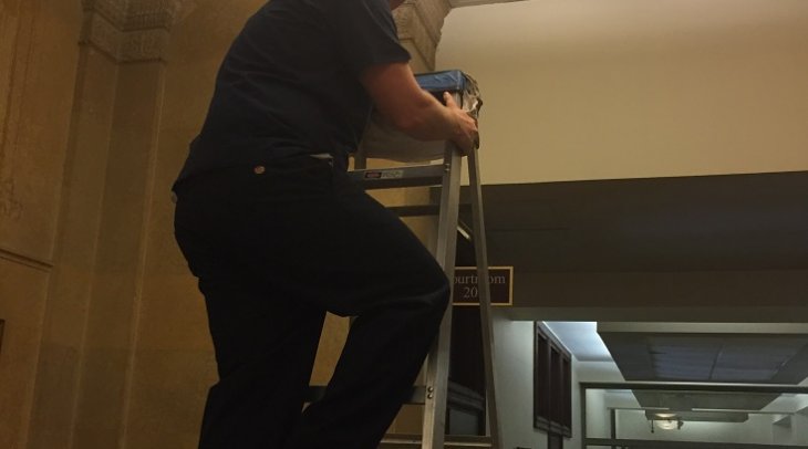 Sharkey on Ladder at Courthouse East